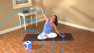 Arctic Air® on the floor with woman practicing yoga